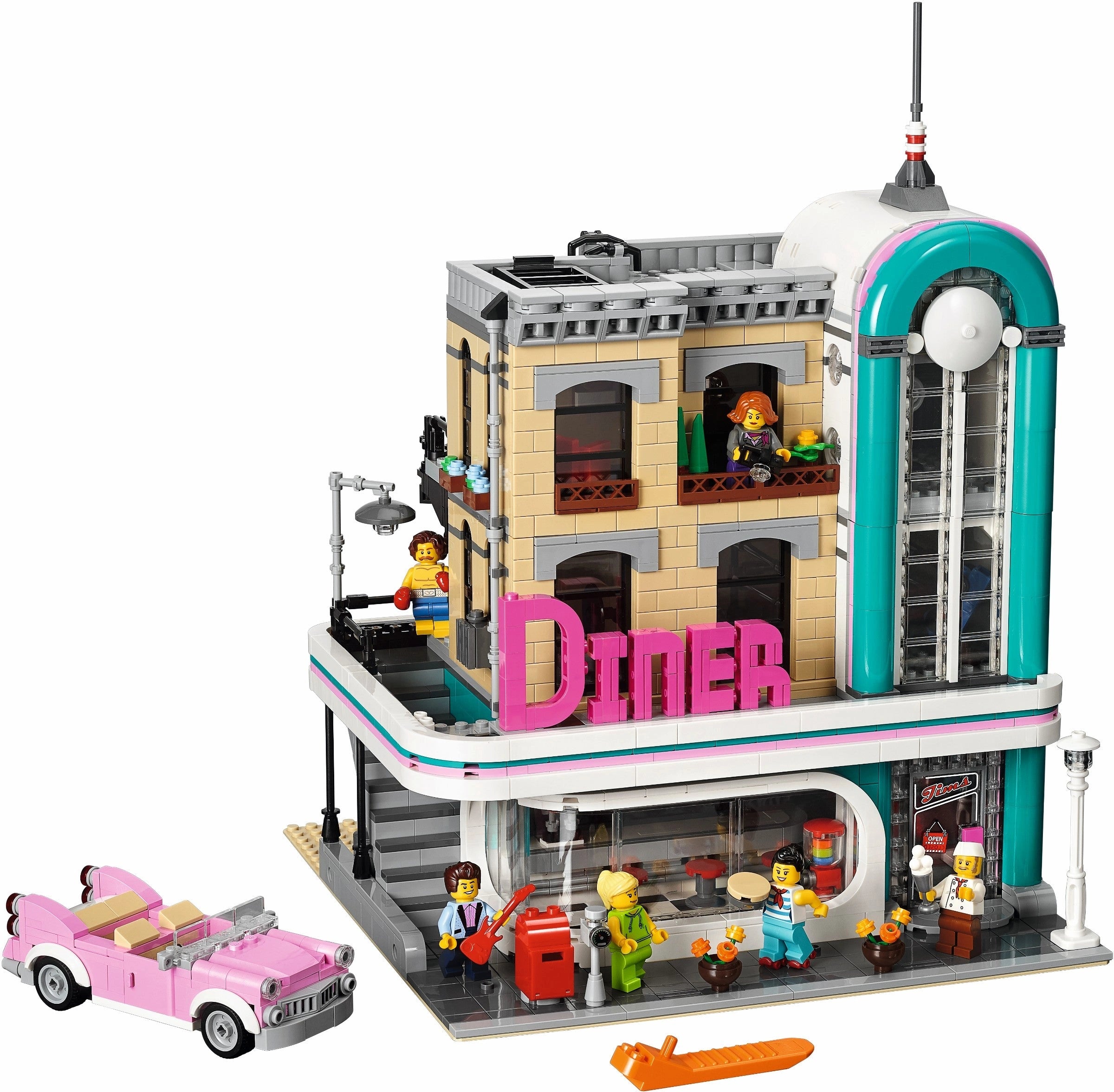 LEGO model of a diner with a pink car and people figures on a white background