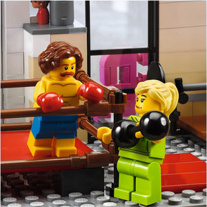 Two LEGO figures in a boxing match inside a LEGO ring.