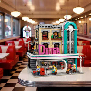 LEGO model of a diner set on a table with a retro restaurant interior background