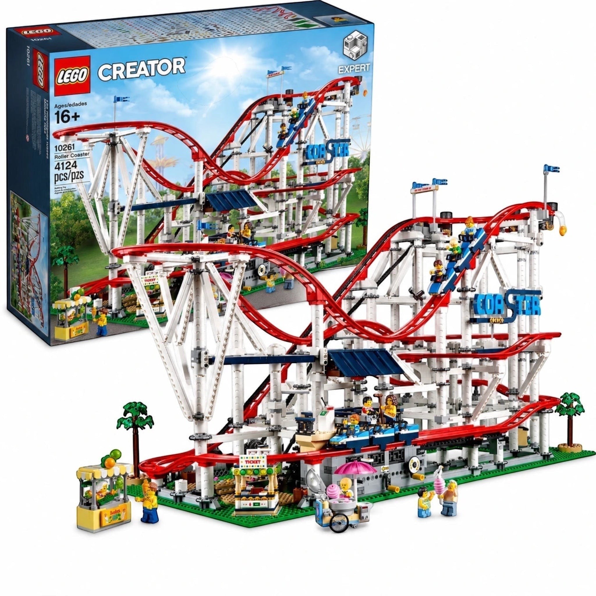 LEGO Creator roller coaster set shown with its retail box on a white background. The assembled model features a complex red and white roller coaster with blue accents, a green base, and several small minifigures and stalls.
