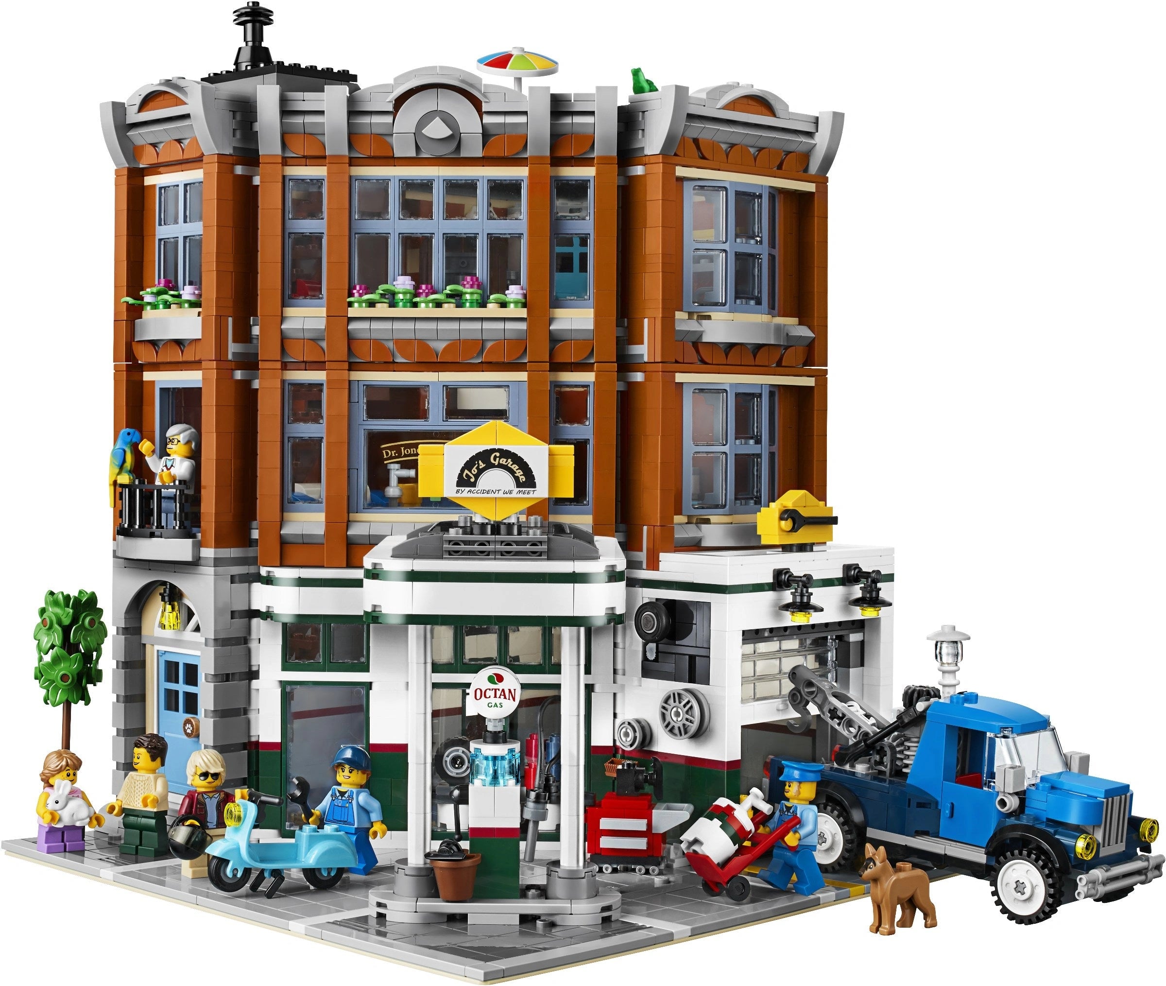 Toy city street scene with buildings, vehicles, and people on a white background