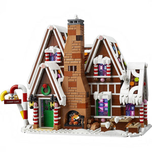 Legion gingerbread house with candy decorations on a white background