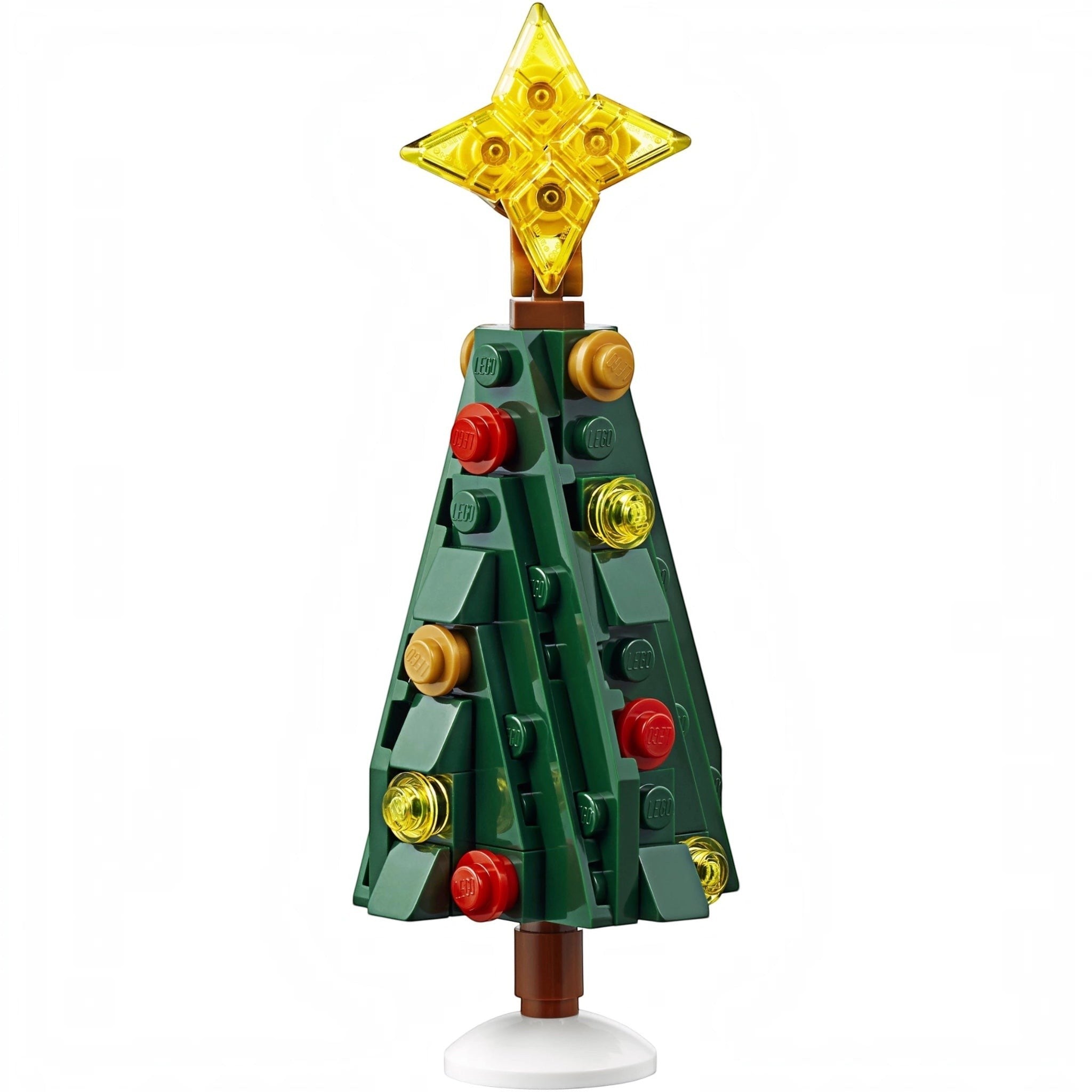 Toy Christmas tree made of interlocking bricks with a star on top, on a white background.