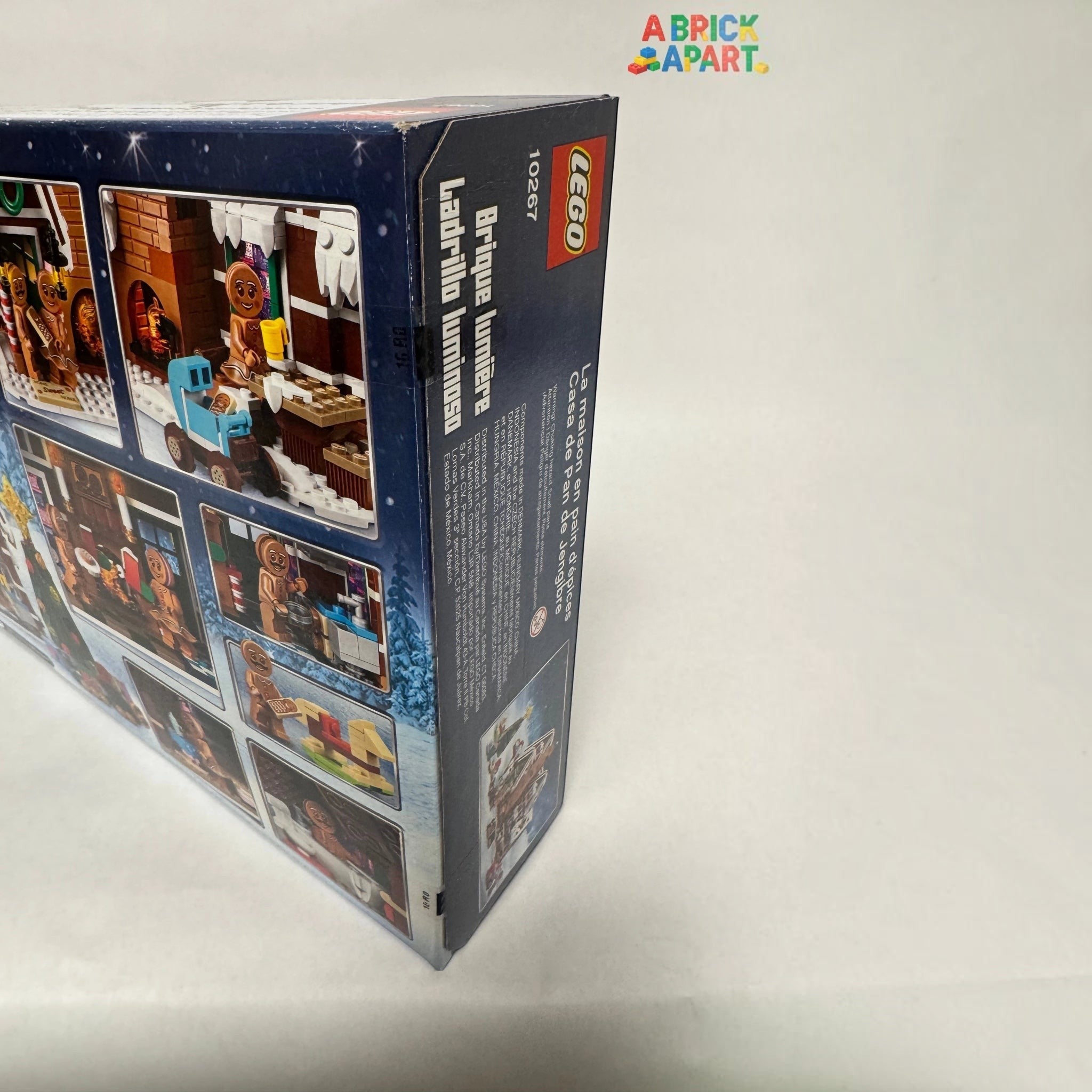 Back view of a LEGO set packaging with images and text on a light gray background.