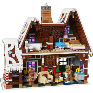 Toy gingerbread house with detailed interior and characters on a white background