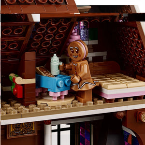 LEGO gingerbread man character with a bottle in a festive setting