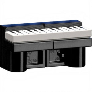 Small keyboard with black and white keys on a black base