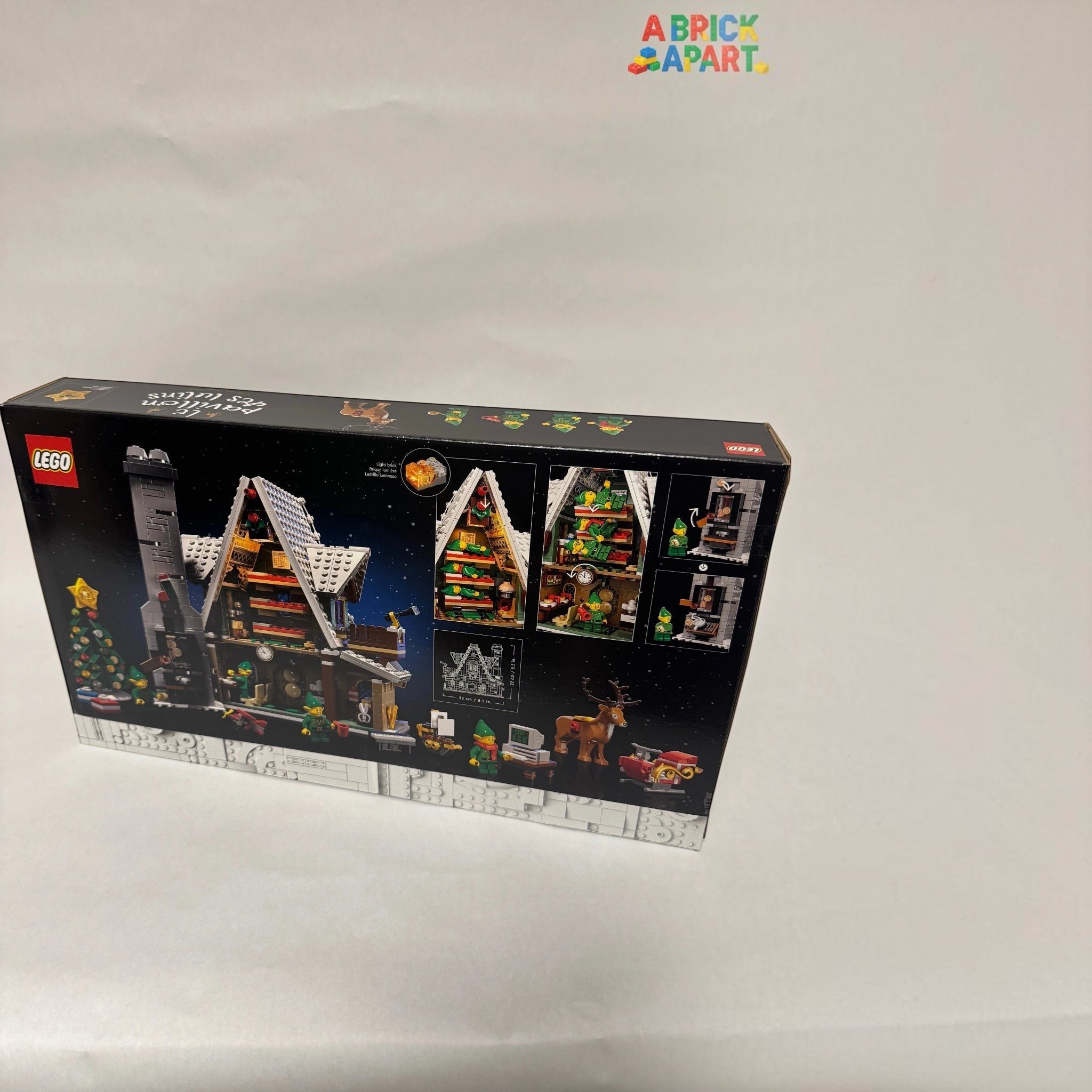 LEGO set packaging with Christmas village design on a white background