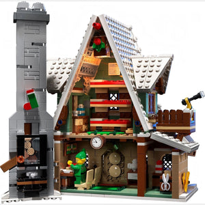 Toy house model with detailed interior and characters on a white background