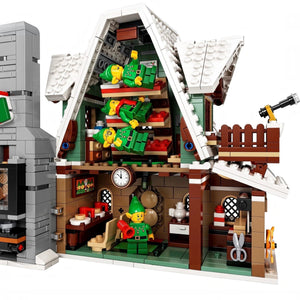 Detailed LEGO model of a house interior with various elements and furniture.