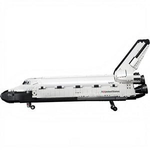 Model of a space shuttle with NASA branding on a white background
