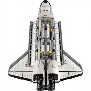 Model of a space shuttle made from interlocking bricks on a white background