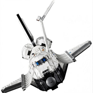 Model of a space shuttle made from interlocking bricks on a white background