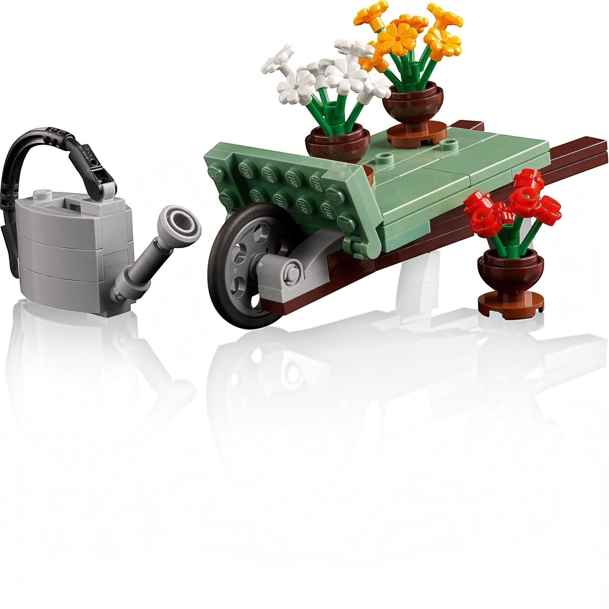LEGO set with a watering can, table, and potted flowers on a white background