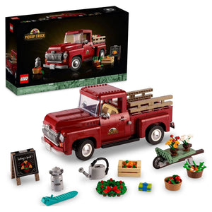 LEGO pickup truck set with packaging and accessories on a white background