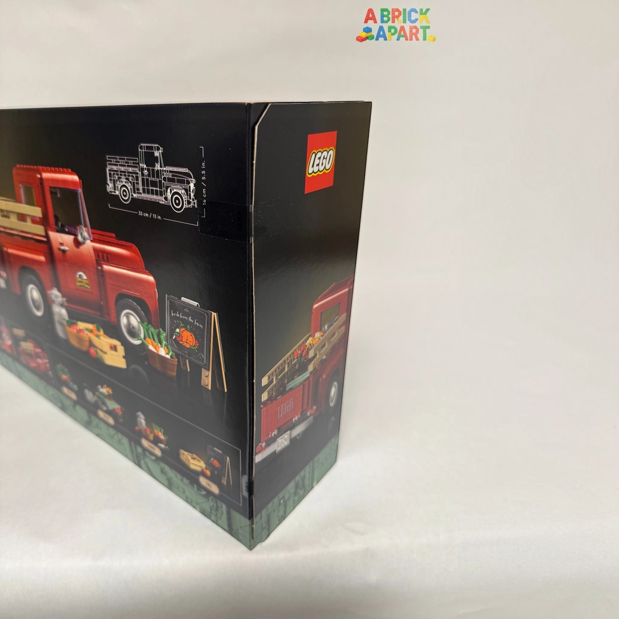 LEGO truck set packaging with red truck illustration on a white background
