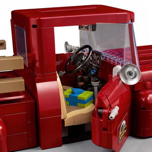 Close-up of a red toy truck with detailed interior and accessories.