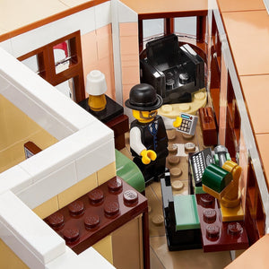 Close-up of a LEGO scene with a character in a bar setting, including a cash register and drinks.