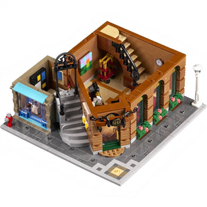 LEGO model of a detailed building with various elements on a white background