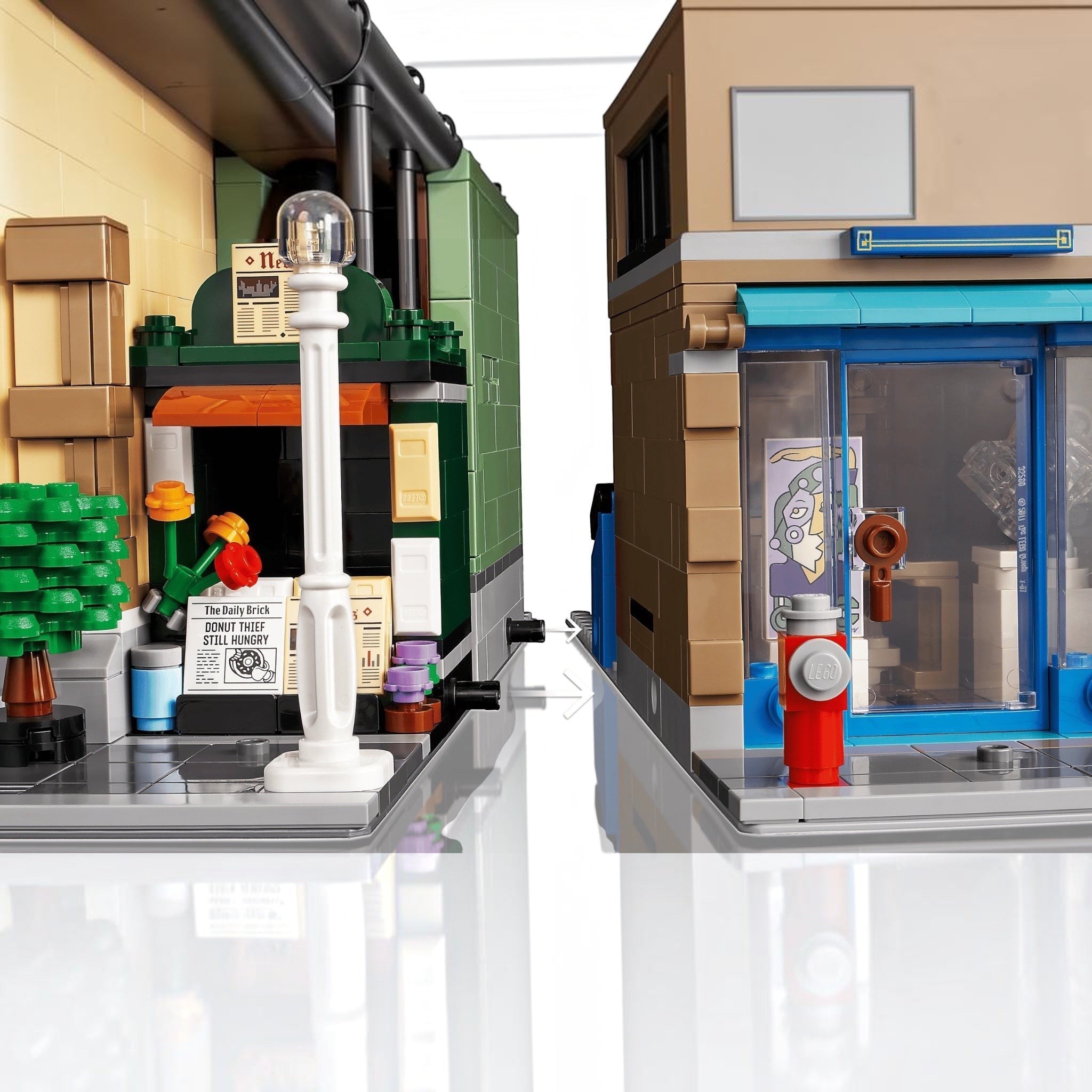 Close-up of a LEGO model with a fire hydrant and store front