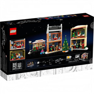LEGO set packaging with Christmas-themed buildings and characters on a black background