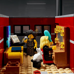 LEGO scene with characters in a room with furniture and decor