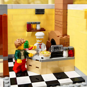 LEGO kitchen set with a chef and customer in a restaurant setting