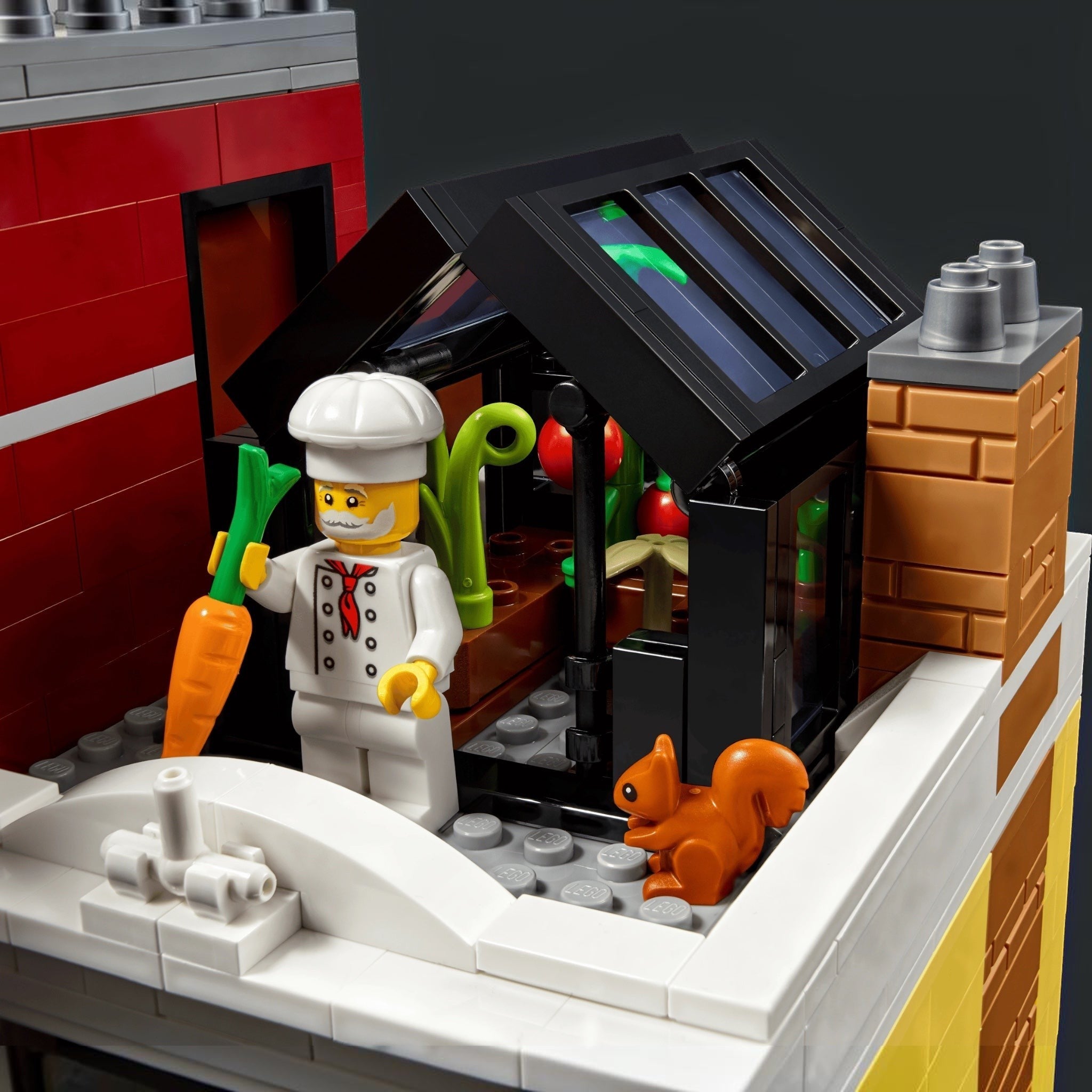 LEGO chef figure with a kitchen setup and a squirrel near a door.