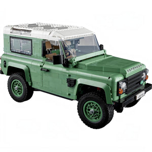 Green Land Rover Defender model on a white background