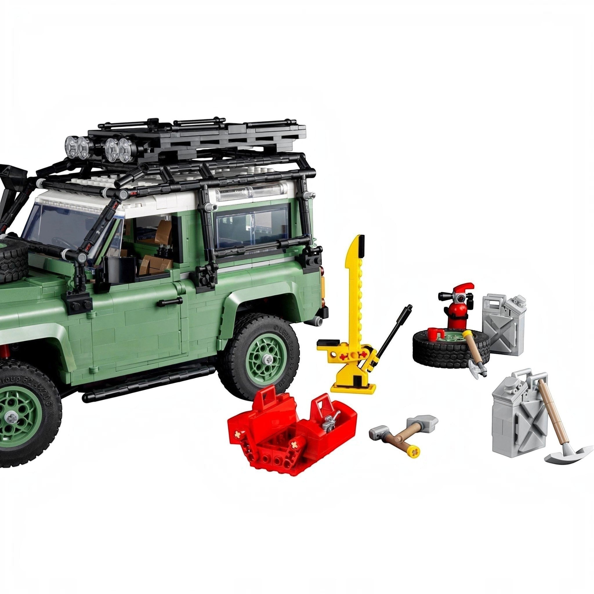 LEGO model of a green SUV with various accessories on a white background