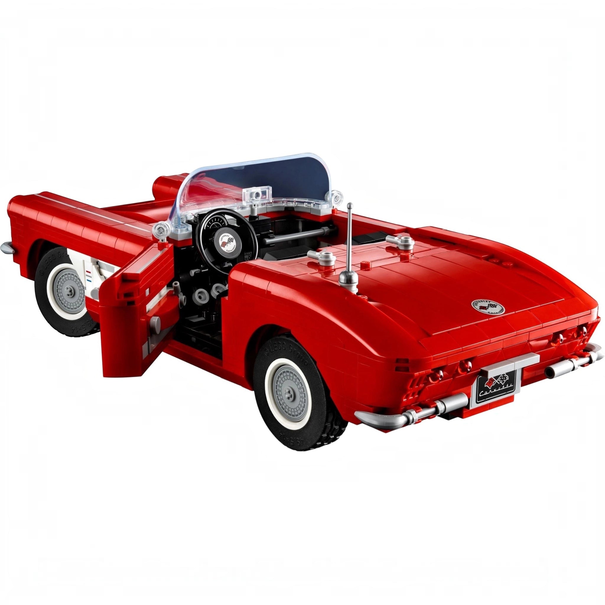 Red convertible car model made of interlocking bricks on a white background