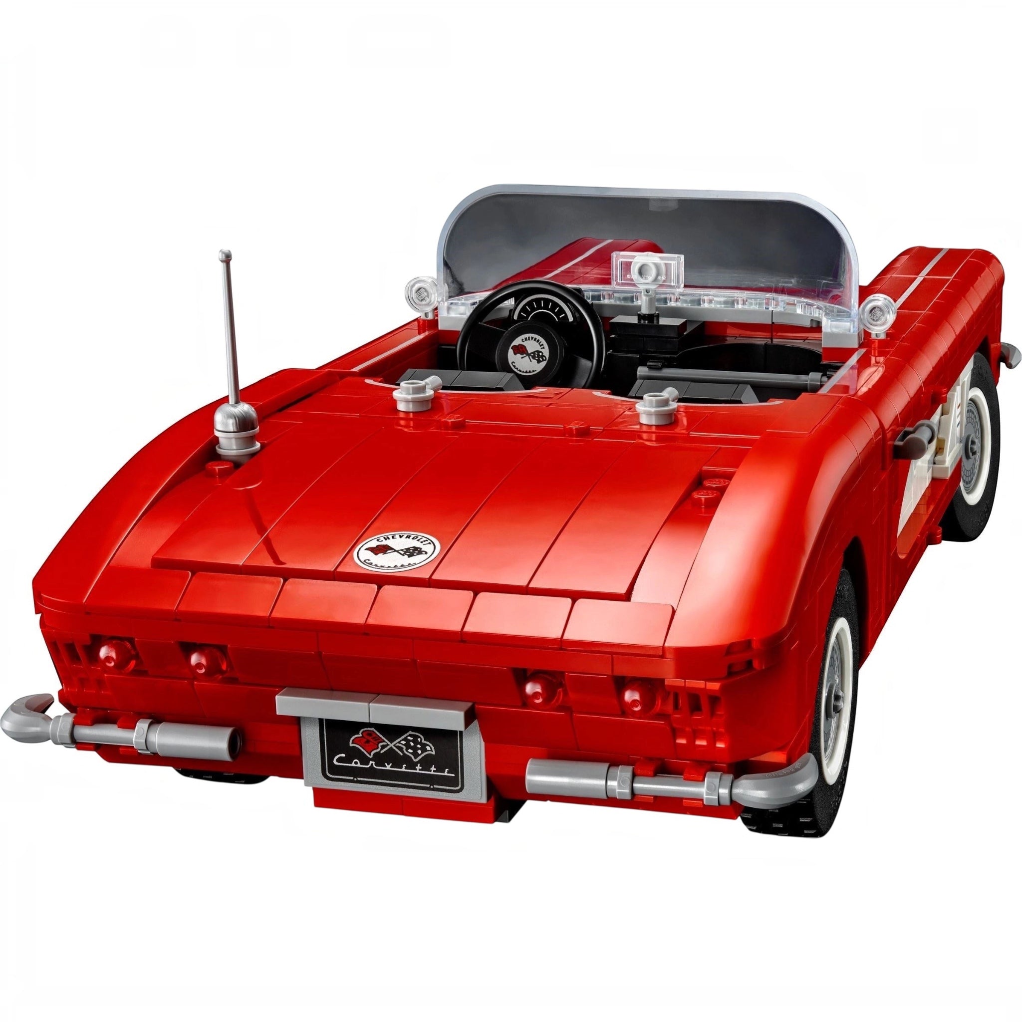 Red toy car model on a white background