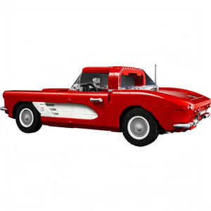 Red classic car model on a white background