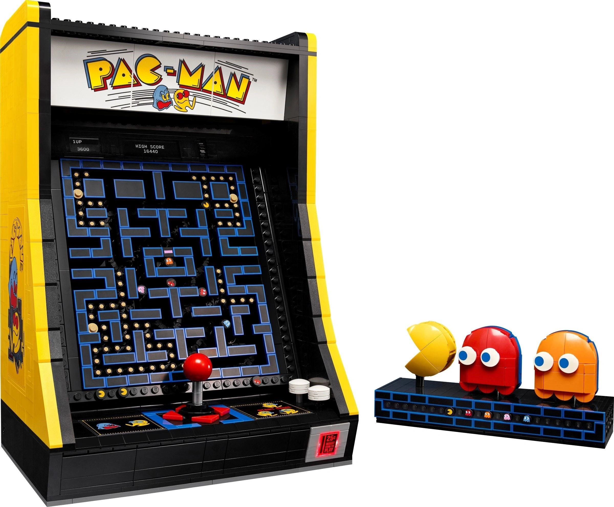 Pac-Man arcade machine with character figures on a white background