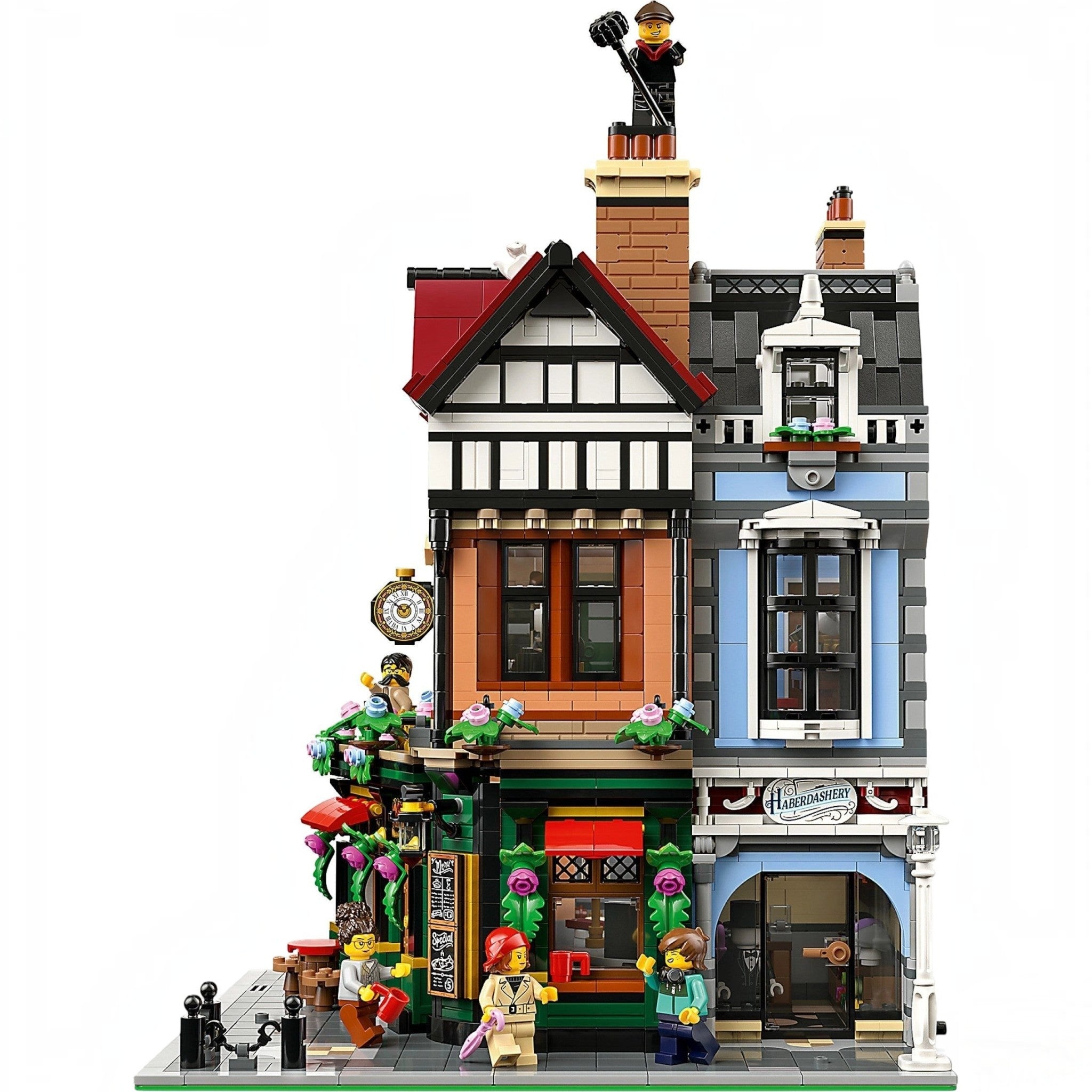 Detailed LEGO model of a townhouse with various elements and figures on a white background