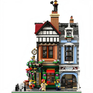 Detailed LEGO model of a townhouse with various elements and figures on a white background
