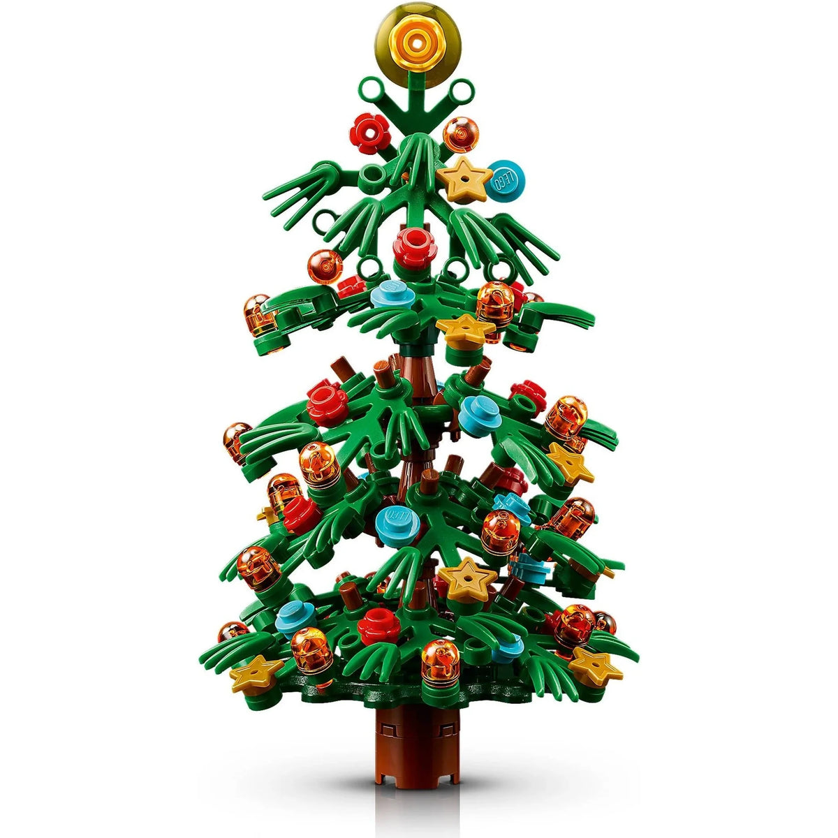 [built-detail] A toy building-block Christmas tree with green branches, a brown trunk, and colorful ornaments including red, blue, yellow, and orange pieces, shown on a white background.