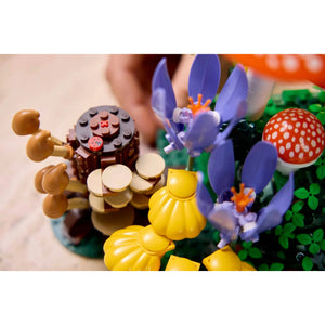 [lifestyle-person] Colorful LEGO model of a mushroom and flowers on a white background