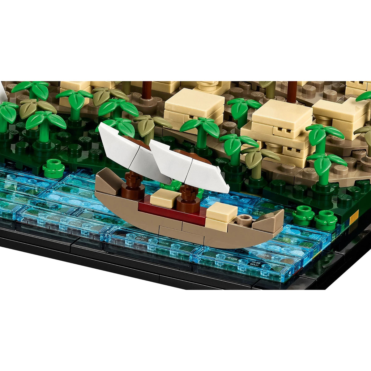 [built-detail] Toy boat on a LEGO-style island with buildings and trees