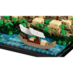 [built-detail] Toy boat on a LEGO-style island with buildings and trees
