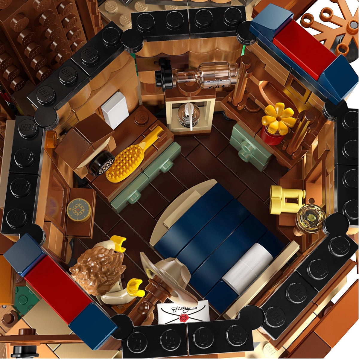 [built-detail] Top-down view of a detailed LEGO model of a living room with furniture and decor.