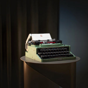Green typewriter on a dark background
