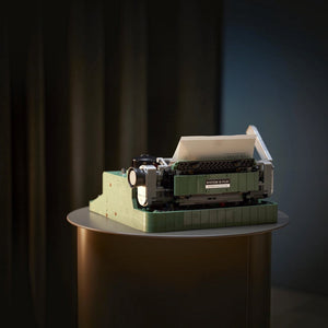 Model of a typewriter on a dark background