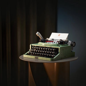 Green typewriter on a dark background