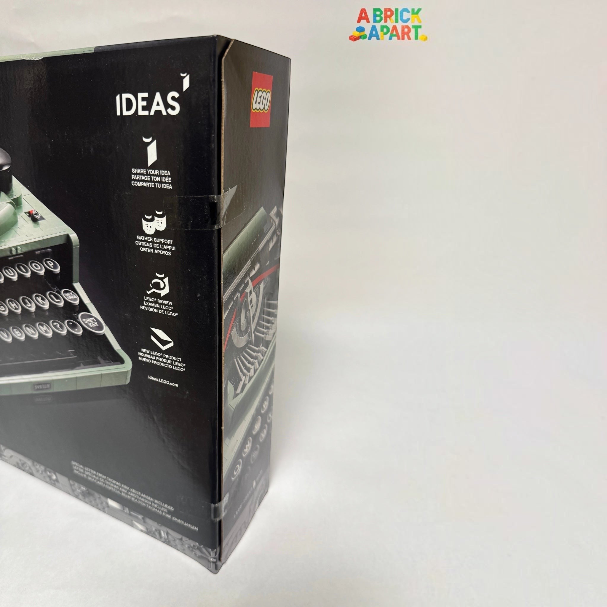 Legos packaging with a typewriter model on a white background