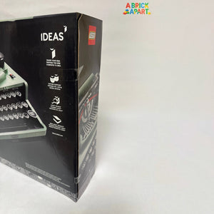 Legos packaging with a typewriter model on a white background