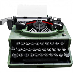 Green typewriter with visible keys on a white background
