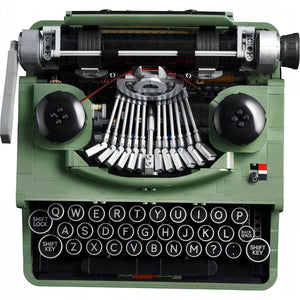 Green typewriter model with intricate mechanical details on a white background