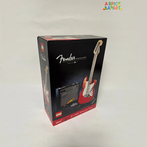 Fender Stratocaster guitar and amplifier model in LEGO packaging on a white background