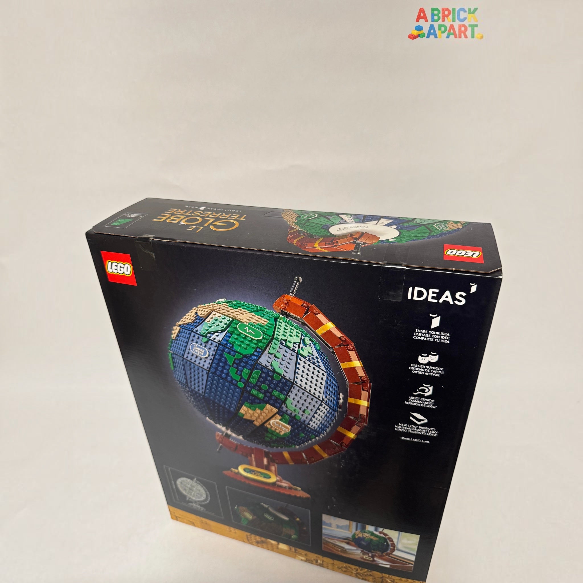 LEGO globe model packaging with branding and product illustration on a white background